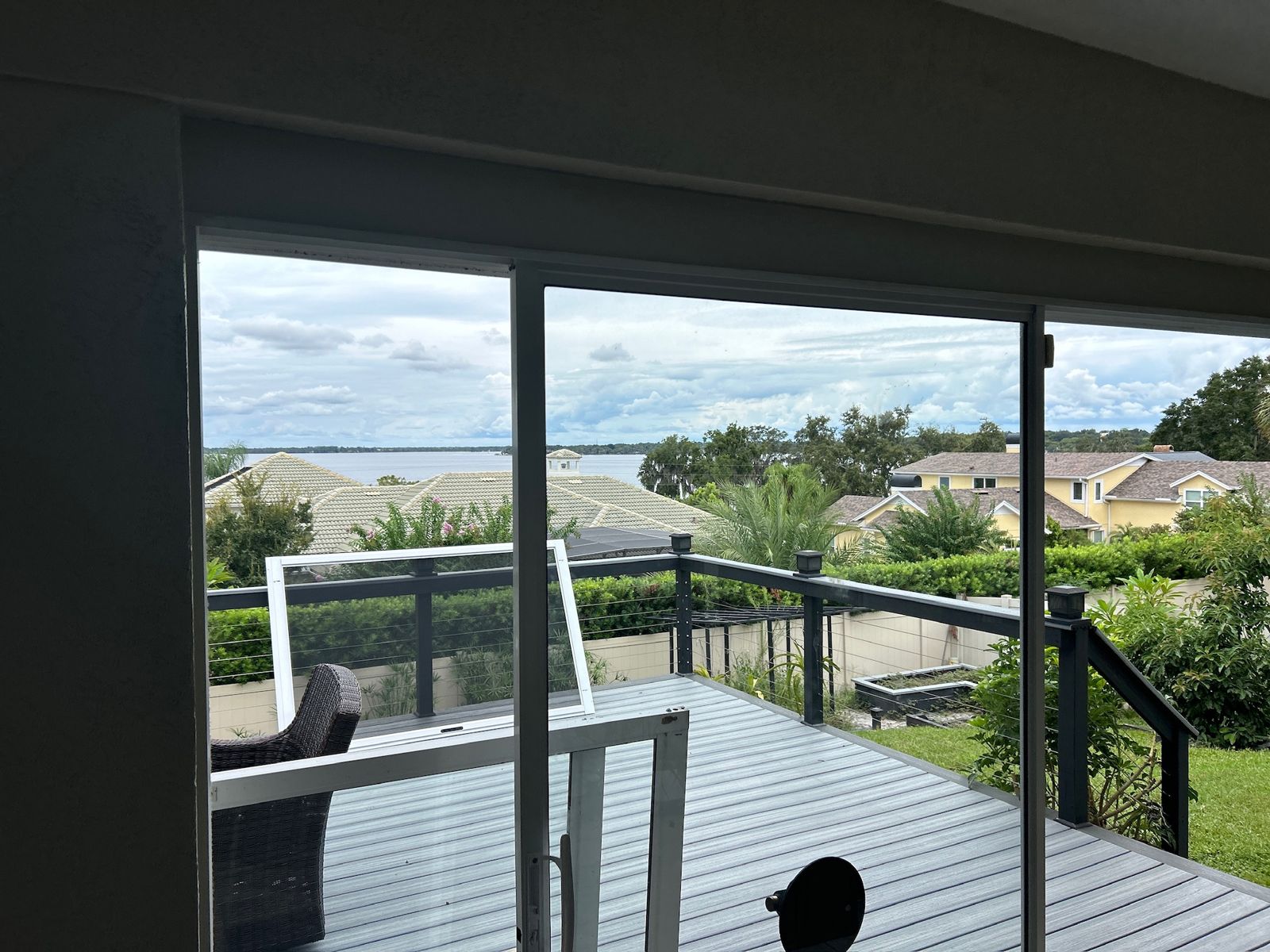 Sliding glass doors opening onto a coastal deck — sliding glass door services in Rockledge, Florida