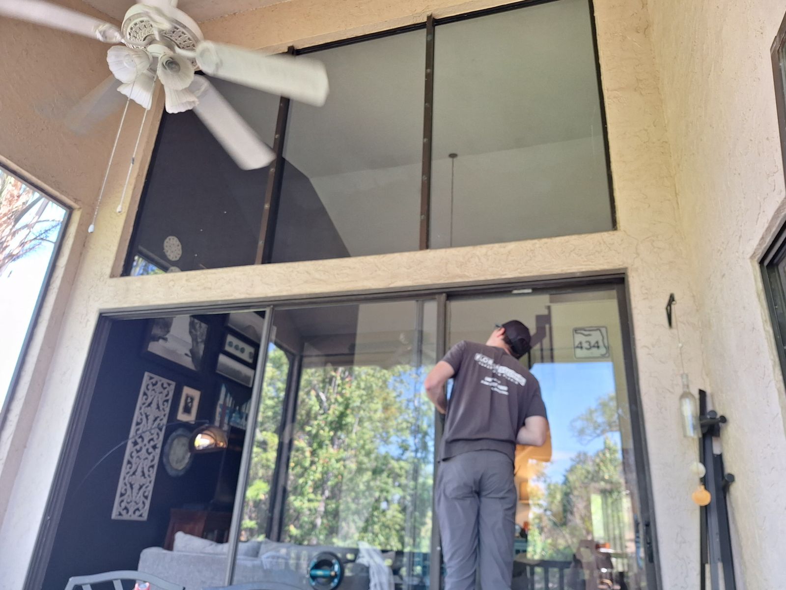 Sliding glass door being serviced in a Florida room — sliding glass door services in Horizon West, Florida