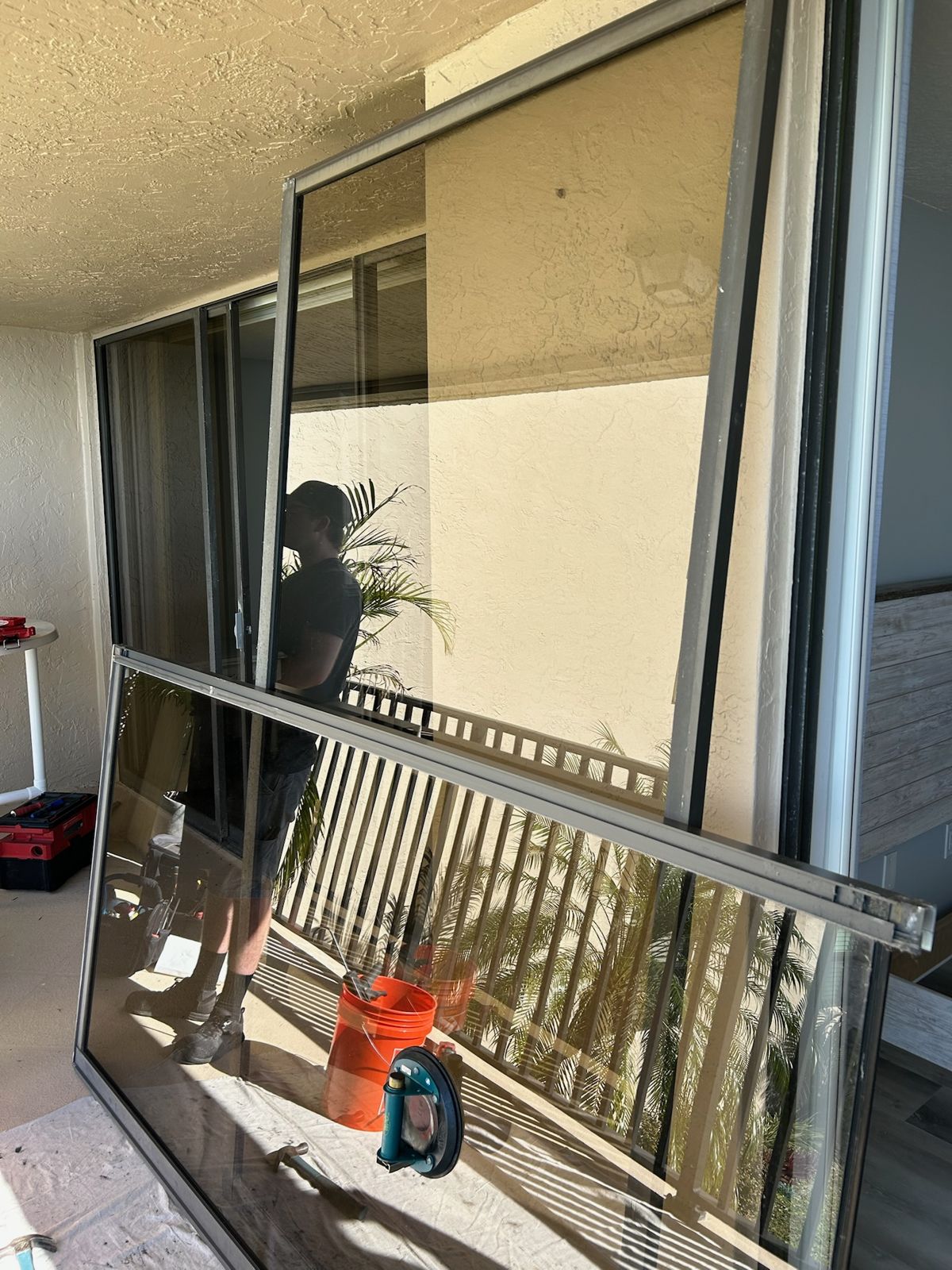 Sliding glass door panel lifted out of the frame for service — sliding glass door repair in Lake Mary, Florida